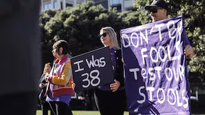 Protesters at Parliament call for lowering of age for free bowel cancer screening